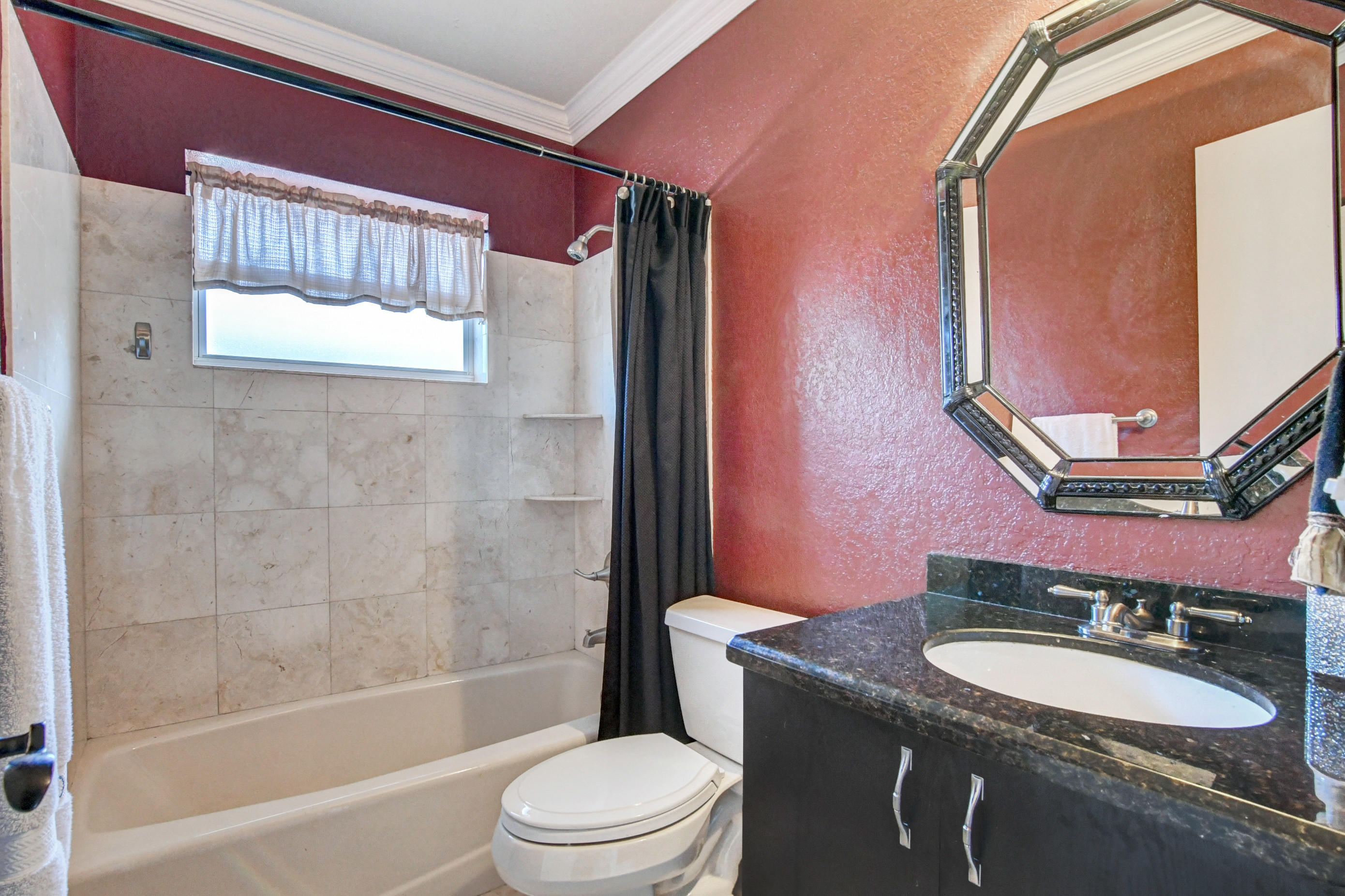 1720 Southwest 9th Street Boca Raton, FL 33486 - Photo 44 of 75 a bathroom with a granite countertop sink mirror toilet and bathtub