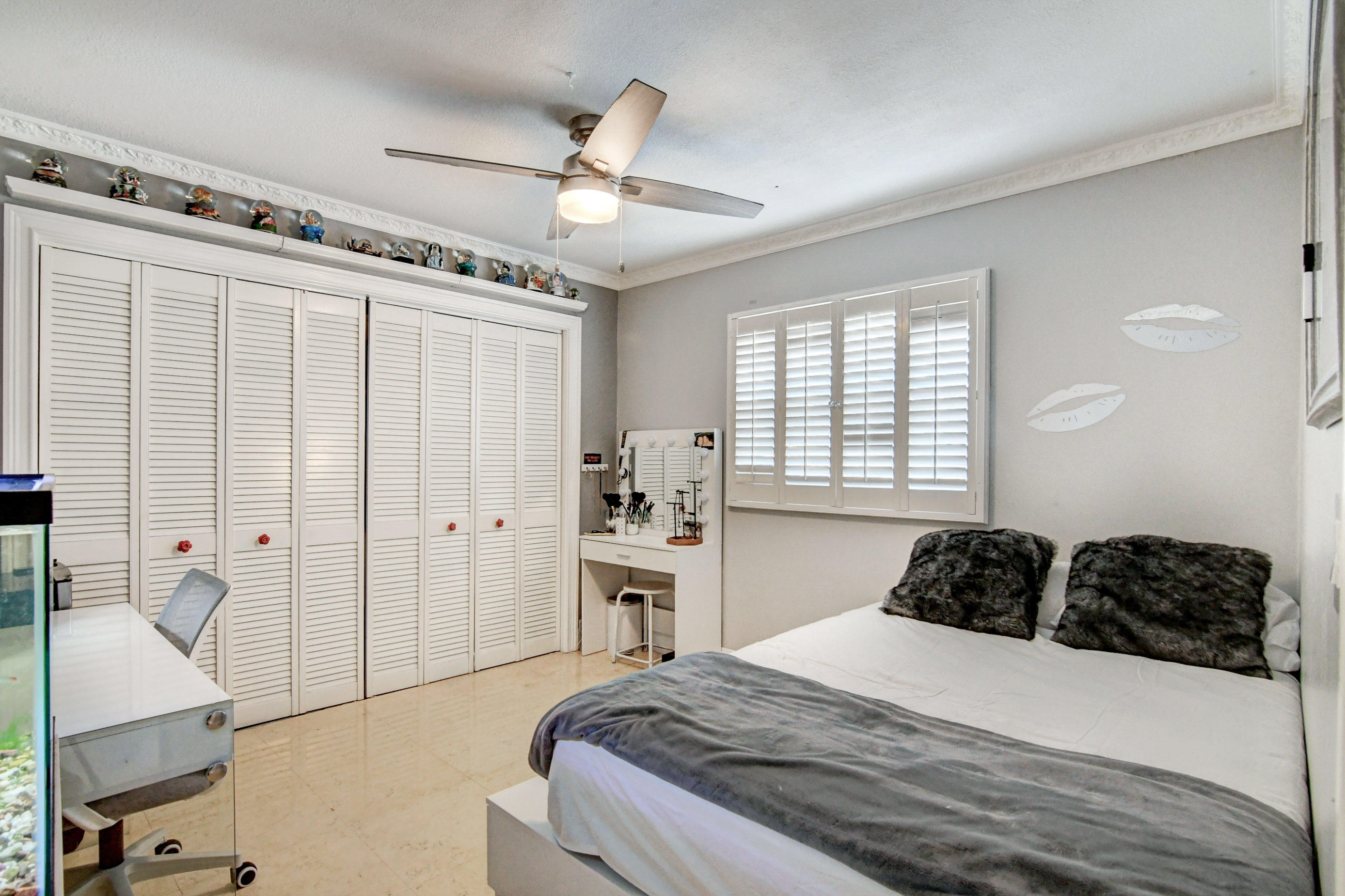1720 Southwest 9th Street Boca Raton, FL 33486 - Photo 45 of 75 a bedroom with a bed and ceiling fan