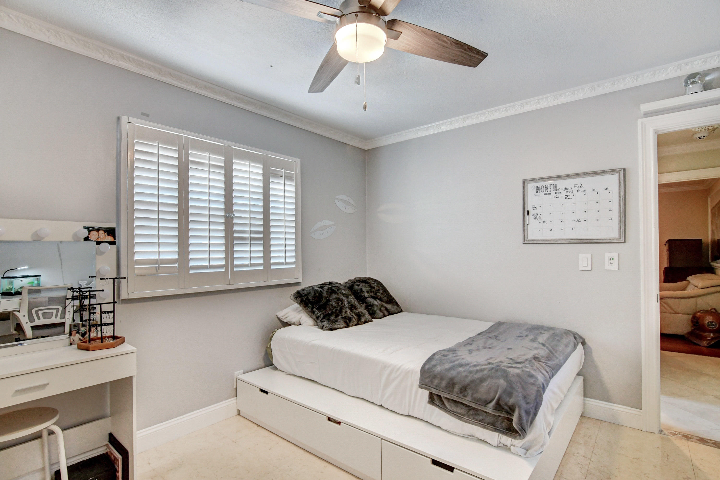 1720 Southwest 9th Street Boca Raton, FL 33486 - Photo 46 of 75 a bedroom with a bed and a chandelier