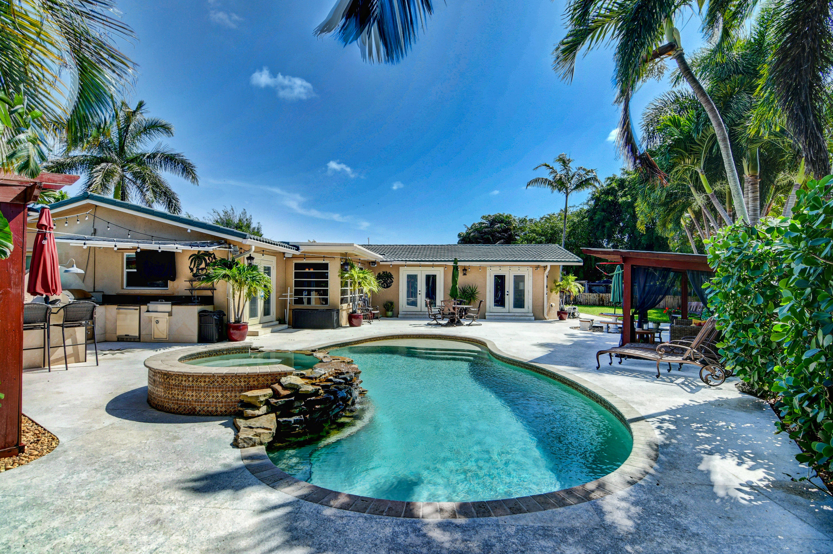 1720 Southwest 9th Street Boca Raton, FL 33486 - Photo 5 of 75 a view of a house with swimming pool and sitting area