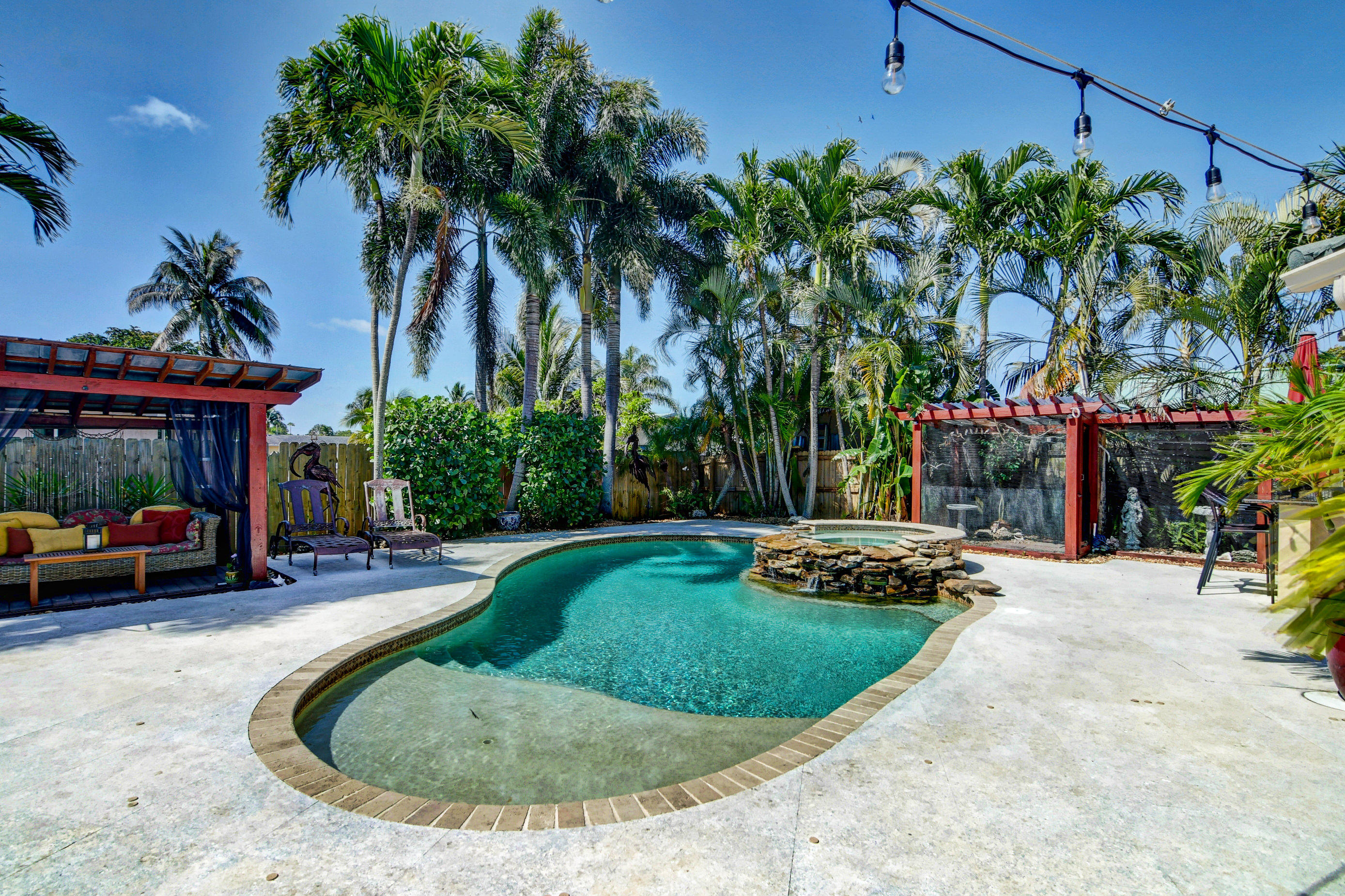 1720 Southwest 9th Street Boca Raton, FL 33486 - Photo 54 of 75 a view of a house with backyard and sitting area