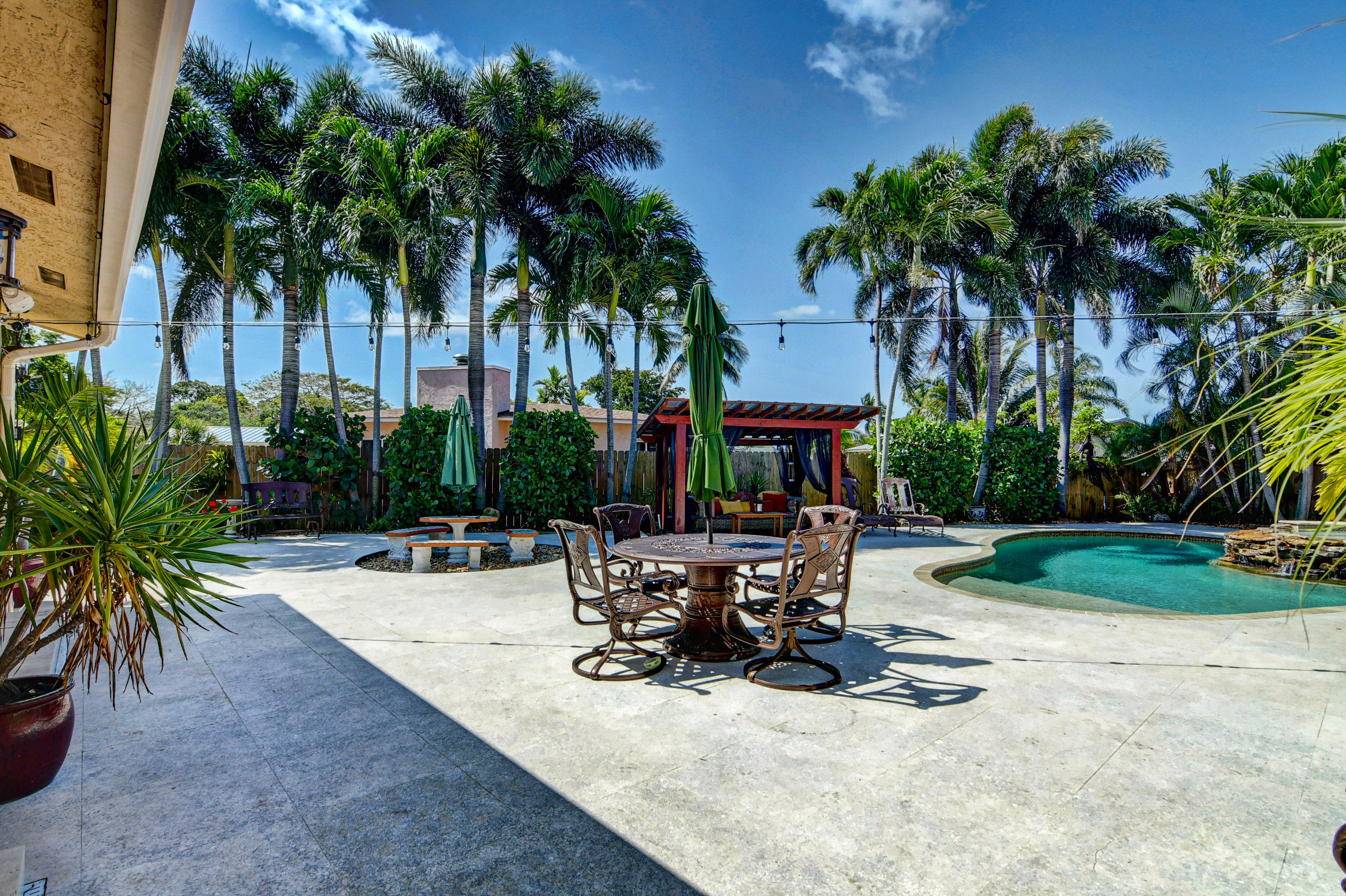 1720 Southwest 9th Street Boca Raton, FL 33486 - Photo 55 of 75 a view of a backyard with a sitting area and furniture