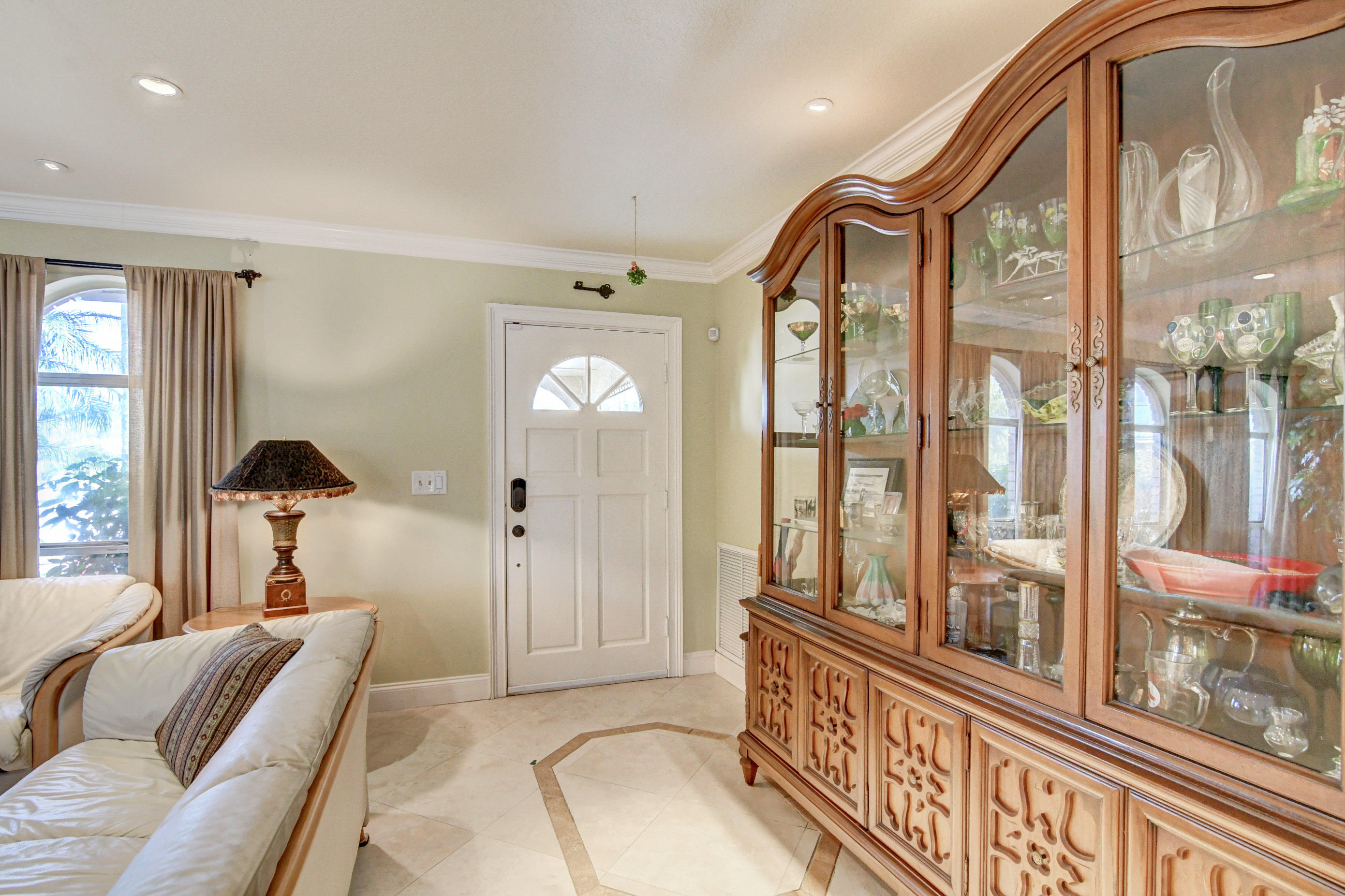 1720 Southwest 9th Street Boca Raton, FL 33486 - Photo 8 of 75 a living room with furniture and a large window