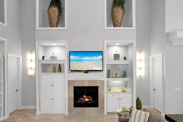 a living room with furniture and a fireplace