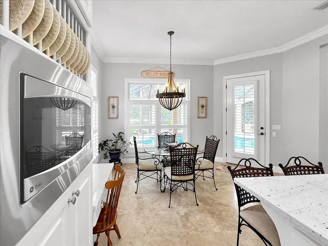 a view of a dining room with furniture window and outside view