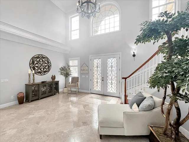 a living room with furniture and a large mirror