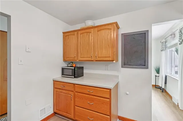a kitchen with stainless steel appliances granite countertop a sink and cabinets