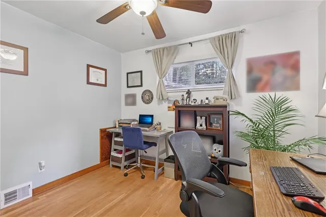 a workspace with furniture and window