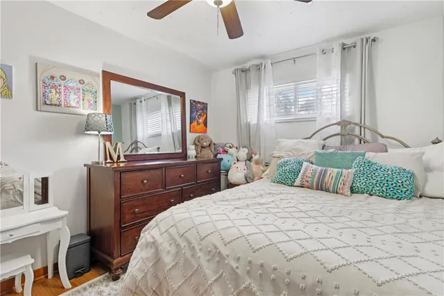a bedroom with a large bed and a dresser