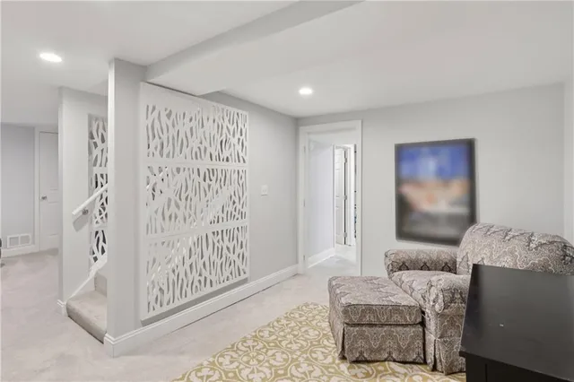 a living room with furniture and a rug