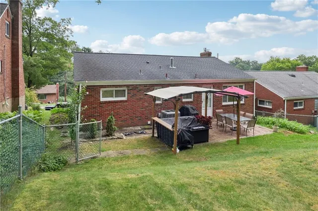 a aerial view of a house with a big yard