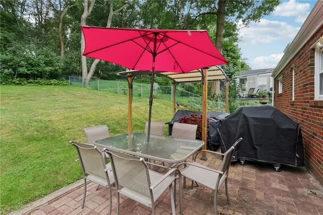 a backyard of a house with seating space