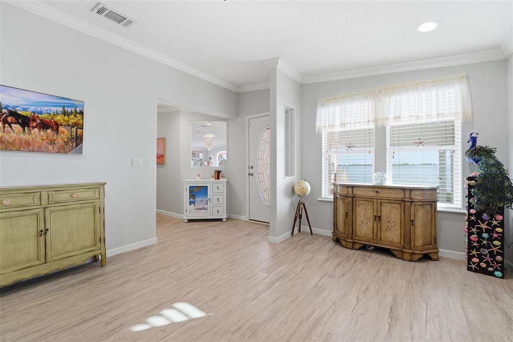 10315 Cortez Road West, Unit 34BV Bradenton, FL 34210 - Photo 22 of 35 a view of an empty room with a window and wooden floor