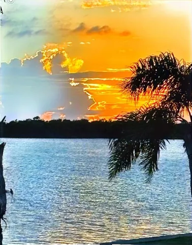 a view of ocean with sunset