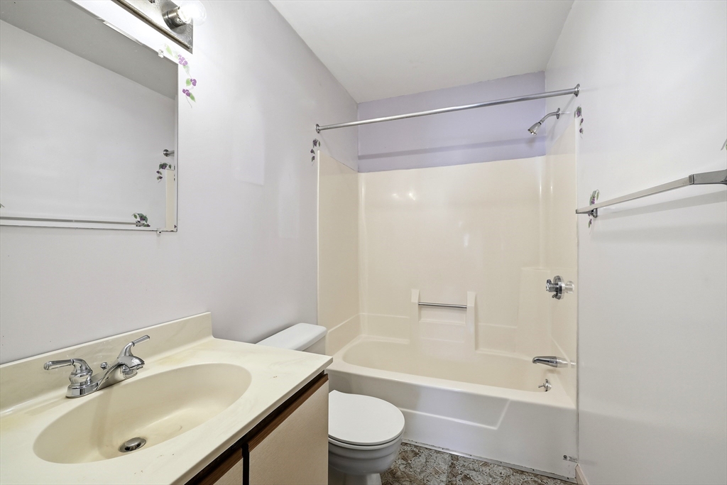 19-21 Wedgewood Circle Springfield, MA 01129 - Photo 21 of 32 a bathroom with a sink a toilet and shower