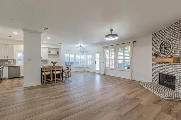 a view of a dining room with furniture window and wooden floor