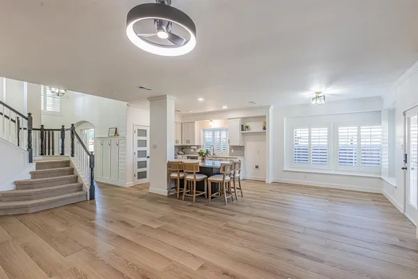 a view of a dining room with furniture and wooden floor
