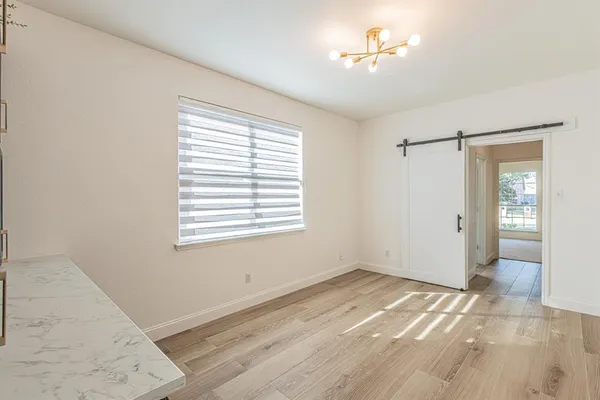 a view of an empty room with a window