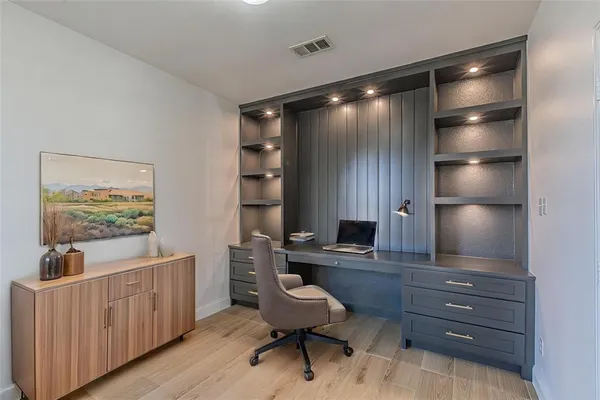 a view of a workspace with furniture
