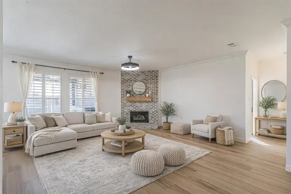 a living room with furniture and a fireplace