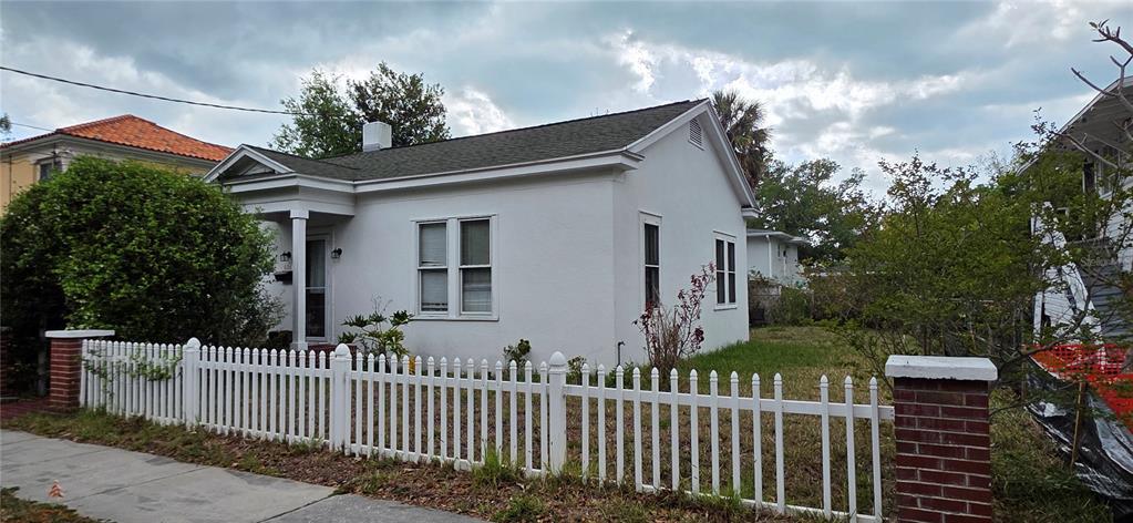 39 Turner Street Clearwater, FL 33756 - Photo 2 of 22 a front view of a house with a garden