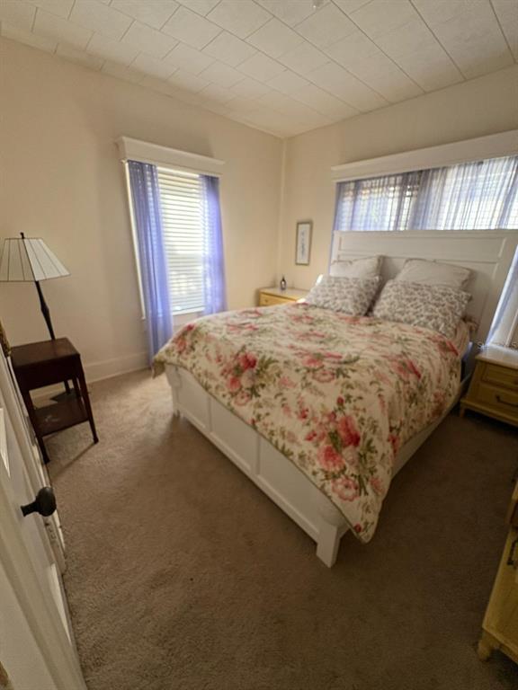 39 Turner Street Clearwater, FL 33756 - Photo 8 of 22 a bed sitting in a bedroom next to a window