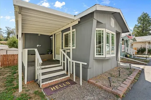 a front view of a house with stairs
