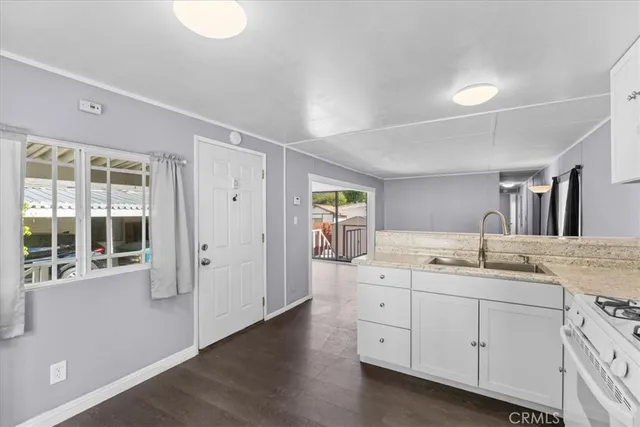 a spacious bathroom with a granite countertop sink mirror and toilet