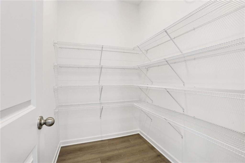 6155 Kismet Road Buford, GA 30518 - Photo 12 of 47 a view of a room with racks on the wall