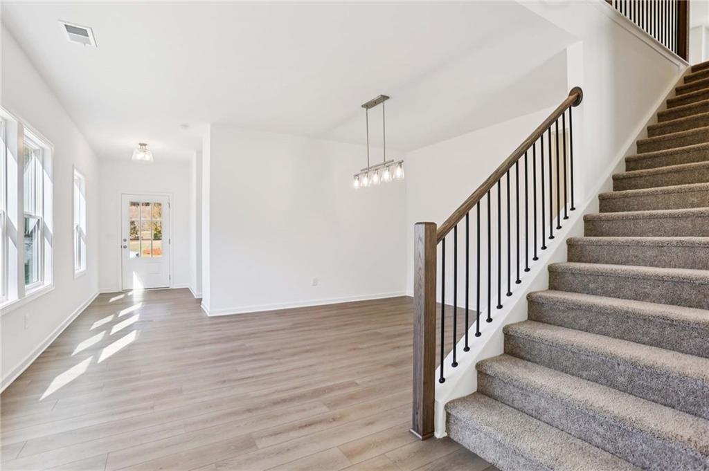 6155 Kismet Road Buford, GA 30518 - Photo 15 of 47 a view of an entryway with wooden floor