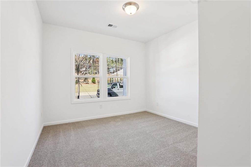 6155 Kismet Road Buford, GA 30518 - Photo 17 of 47 an empty room with windows