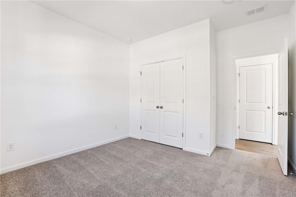 6155 Kismet Road Buford, GA 30518 - Photo 18 of 47 an empty room with closet area