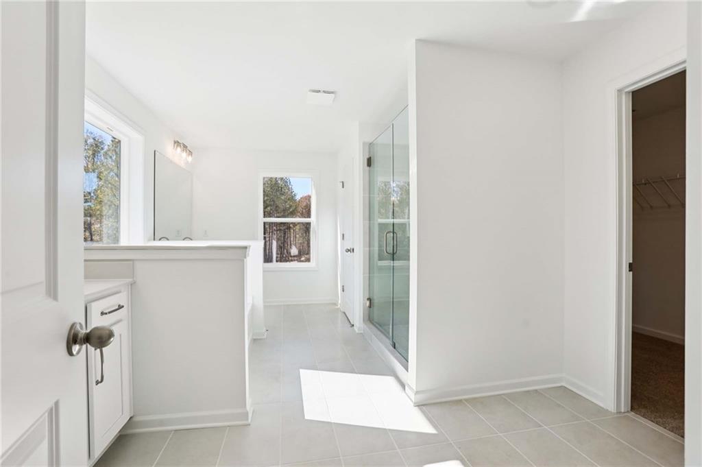 6155 Kismet Road Buford, GA 30518 - Photo 23 of 47 a view of a hallway to rooms