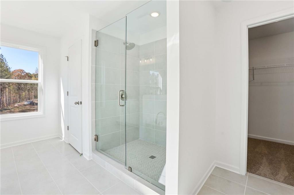 6155 Kismet Road Buford, GA 30518 - Photo 26 of 47 a bathroom with a shower