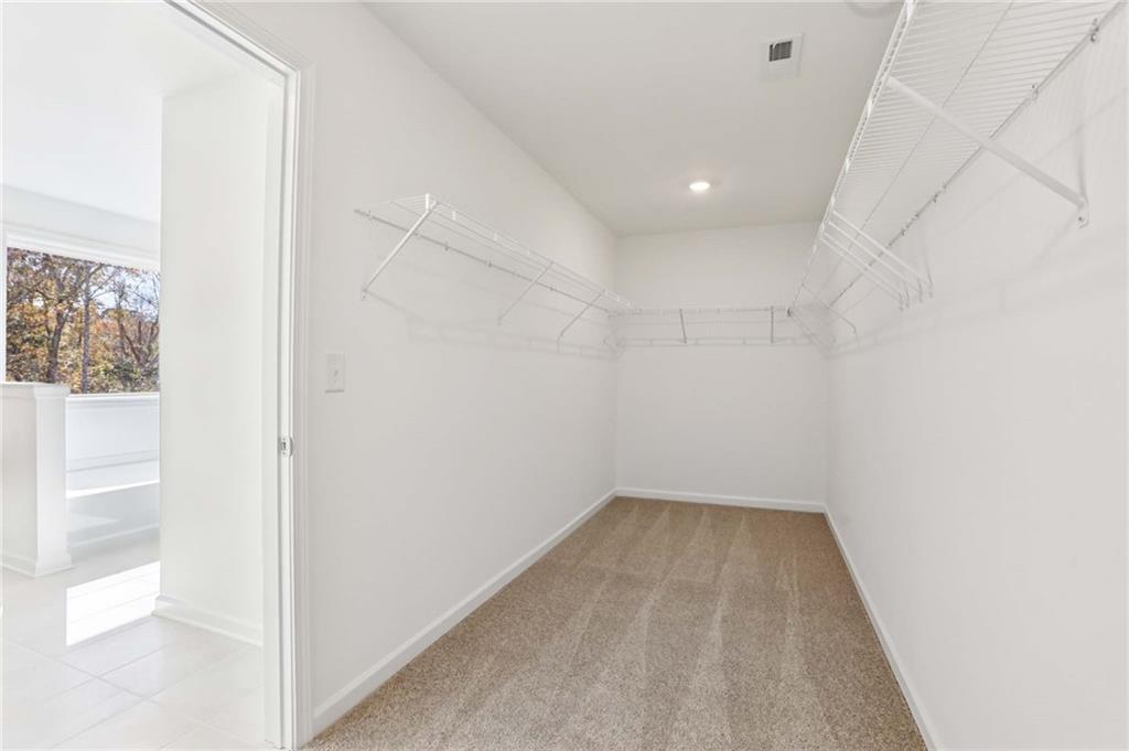 6155 Kismet Road Buford, GA 30518 - Photo 27 of 47 a view of a hallway with wooden floor