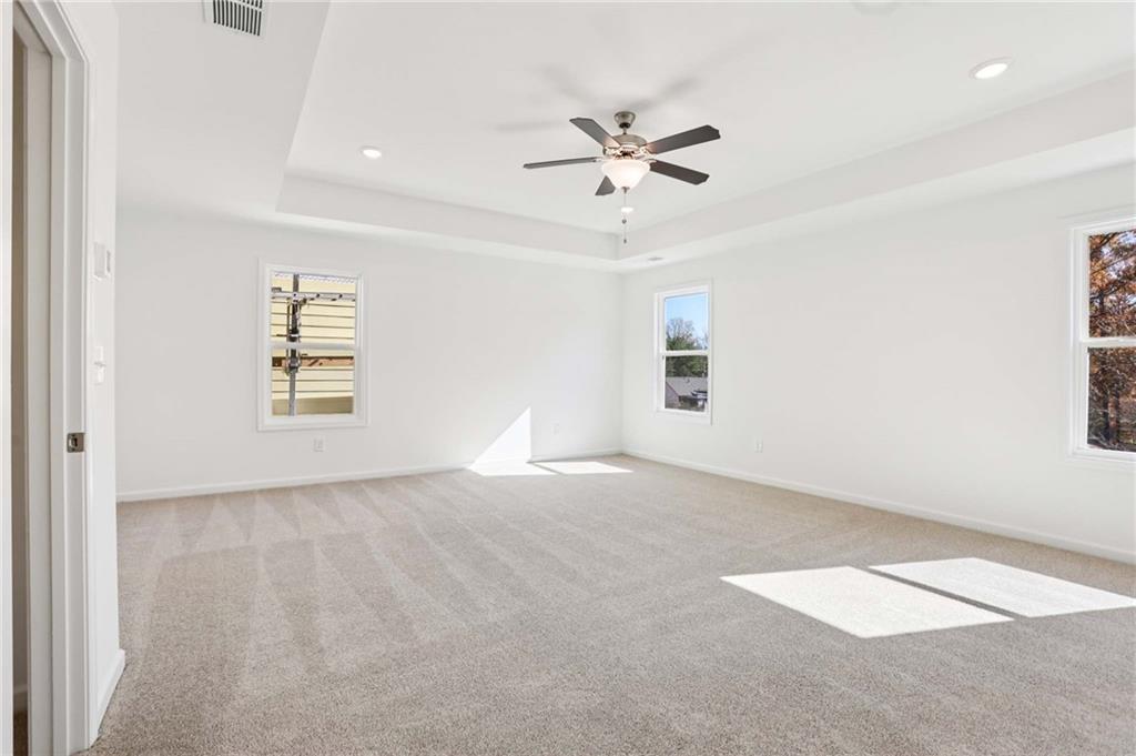 6155 Kismet Road Buford, GA 30518 - Photo 28 of 47 an empty room with windows and fan