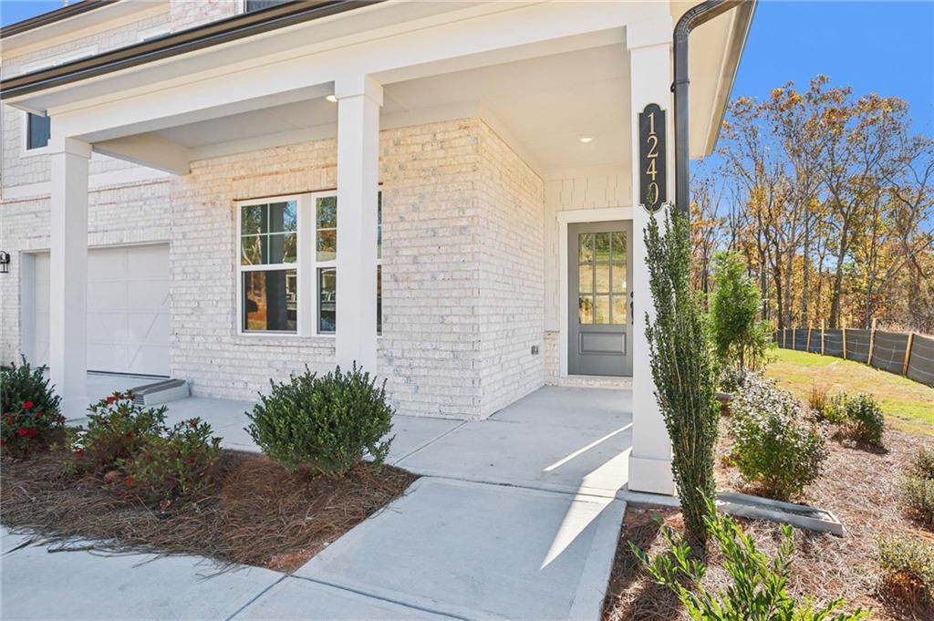 6155 Kismet Road Buford, GA 30518 - Photo 3 of 47 a view of a house with a yard