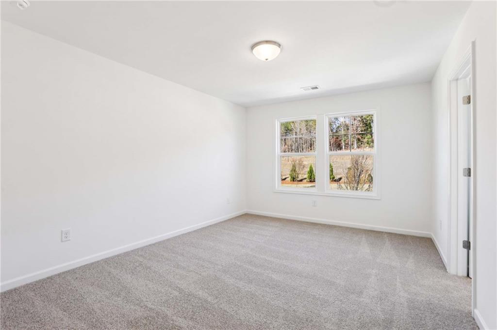 6155 Kismet Road Buford, GA 30518 - Photo 36 of 47 an empty room with windows