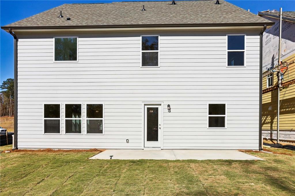 6155 Kismet Road Buford, GA 30518 - Photo 46 of 47 a view of a house with a yard and sitting space