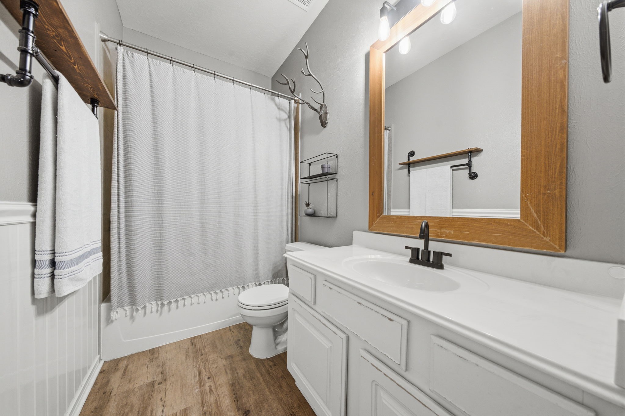 8911 Henrico Lane Rosenberg, TX 77469 - Photo 21 of 45 a bathroom with a sink toilet a mirror and shower