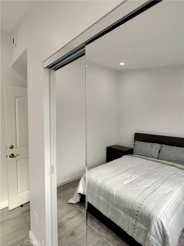 a bedroom with a bed and a walk in closet