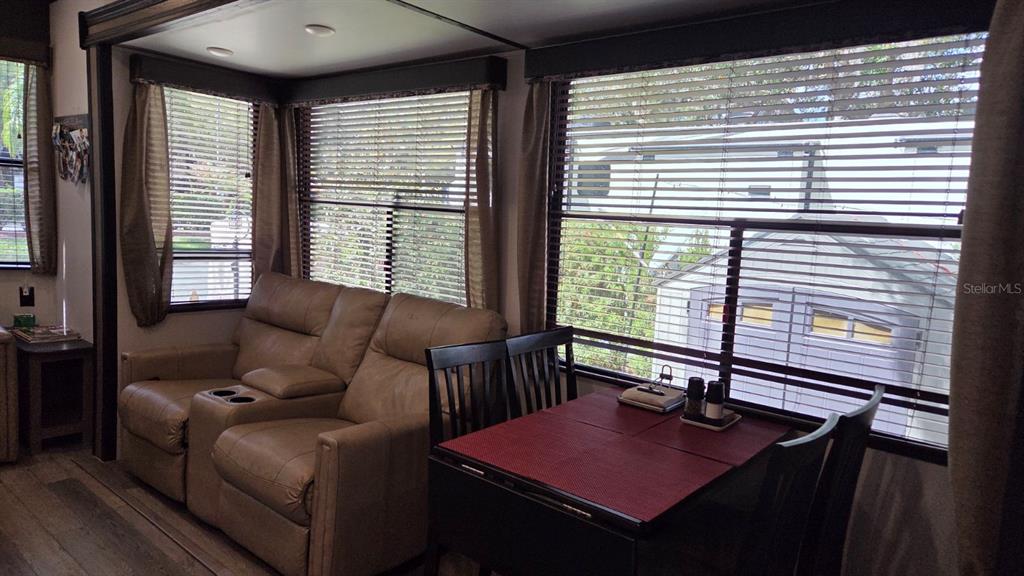 431 Waterway Drive River Ranch, FL 33867 - Photo 12 of 26 a living room with furniture and large windows
