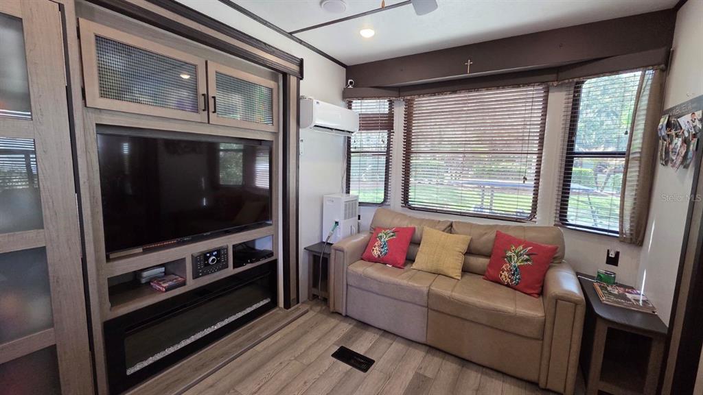 431 Waterway Drive River Ranch, FL 33867 - Photo 14 of 26 a living room with furniture and a flat screen tv