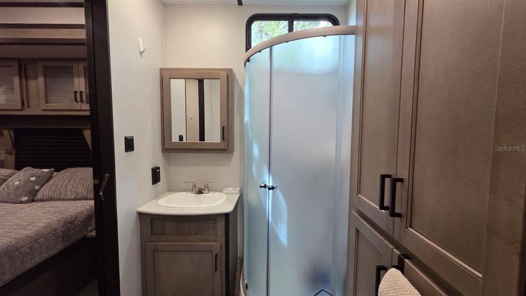 431 Waterway Drive River Ranch, FL 33867 - Photo 20 of 26 a bathroom with a sink and mirror