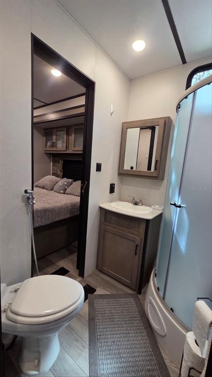 431 Waterway Drive River Ranch, FL 33867 - Photo 21 of 26 a bathroom with a toilet sink and mirror