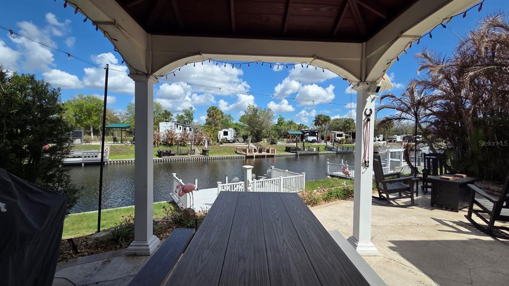 431 Waterway Drive River Ranch, FL 33867 - Photo 3 of 26 a view of river from deck with patio