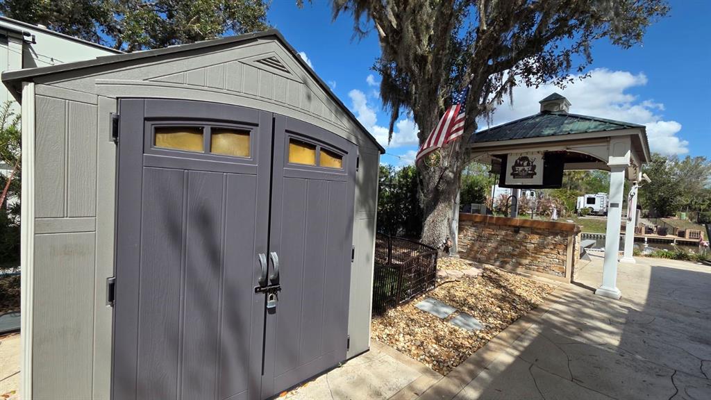 431 Waterway Drive River Ranch, FL 33867 - Photo 9 of 26 a front view of a house with outdoor seating