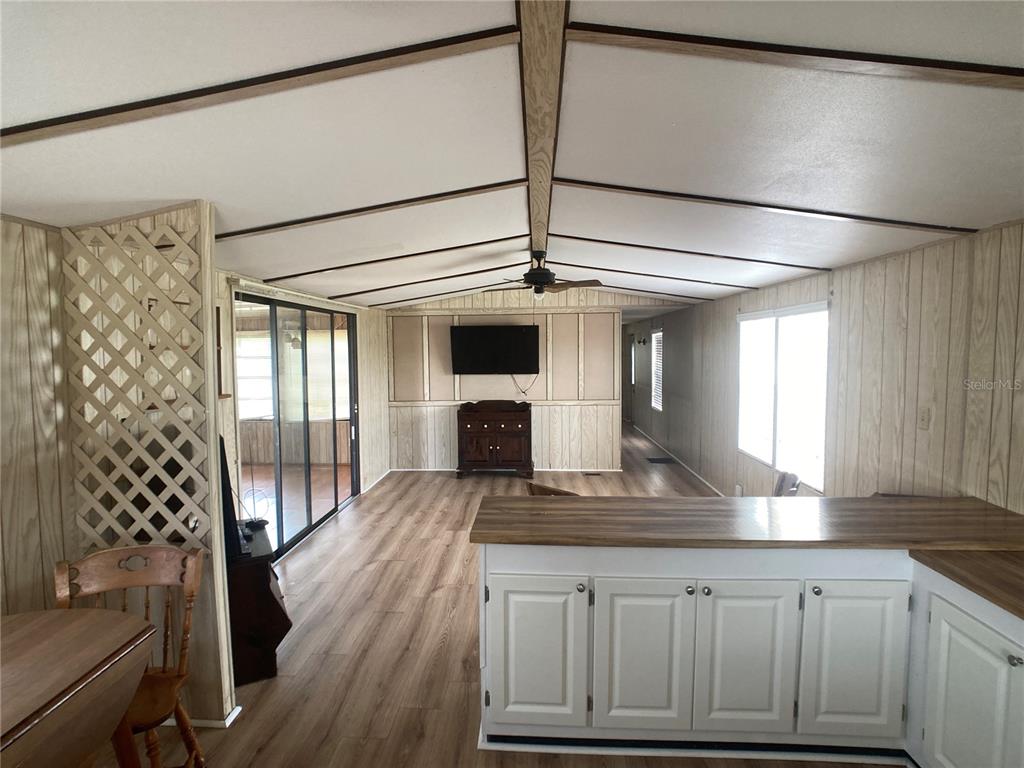 1710 7th Street Southwest, Unit 82 Ruskin, FL 33570 - Photo 11 of 19 a kitchen with a refrigerator and white cabinets