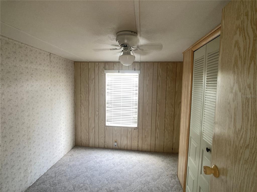 1710 7th Street Southwest, Unit 82 Ruskin, FL 33570 - Photo 12 of 19 a view of an empty room with a window