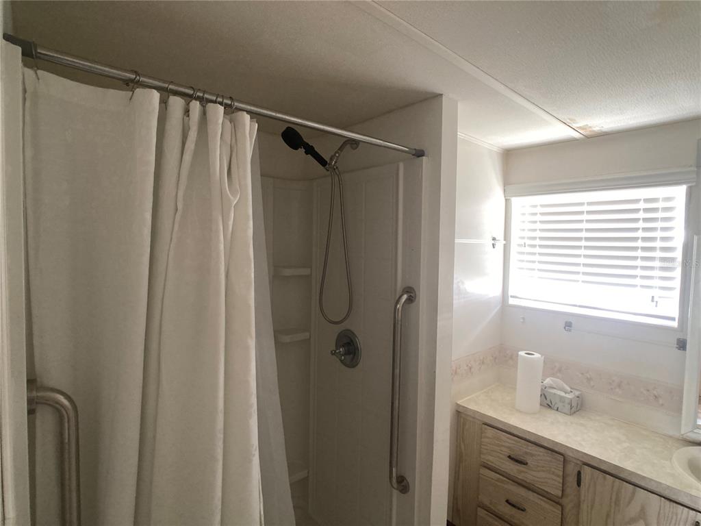 1710 7th Street Southwest, Unit 82 Ruskin, FL 33570 - Photo 14 of 19 a bathroom with a shower and a sink